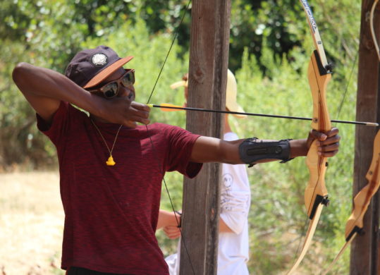 boy practicing archery