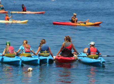 summer campers and guide kayaking off the coast of Catalina Island