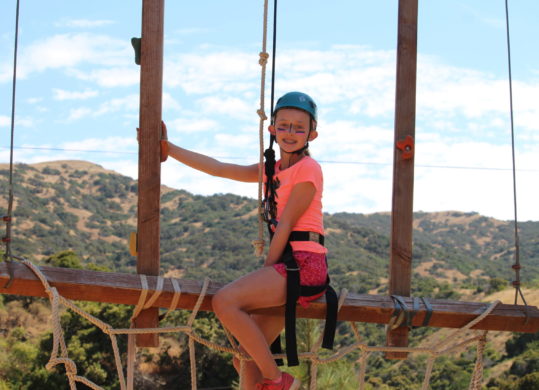 girl on ropes course