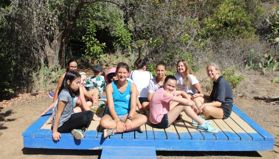 girls sitting in a group