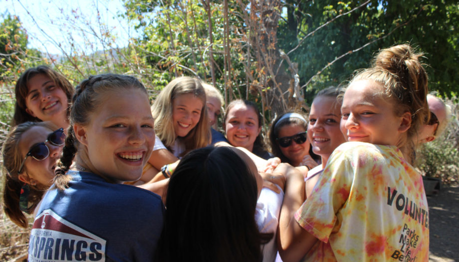 girls in a circle celebrating