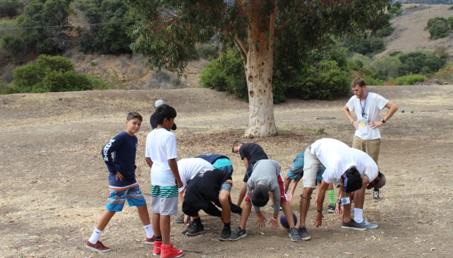 Challenge activity with boys in a circle