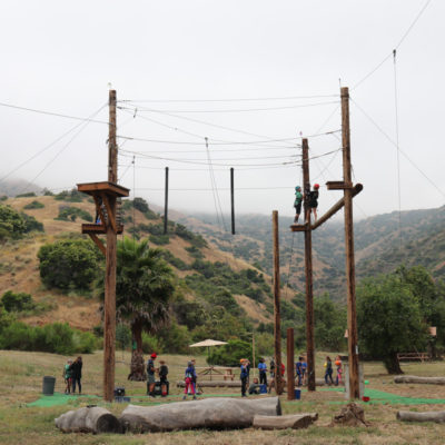 summer campers on a ropes course