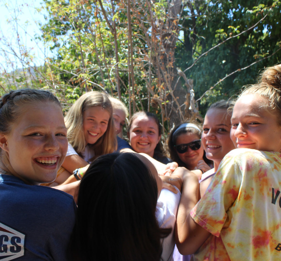 girls in a circle celebrating