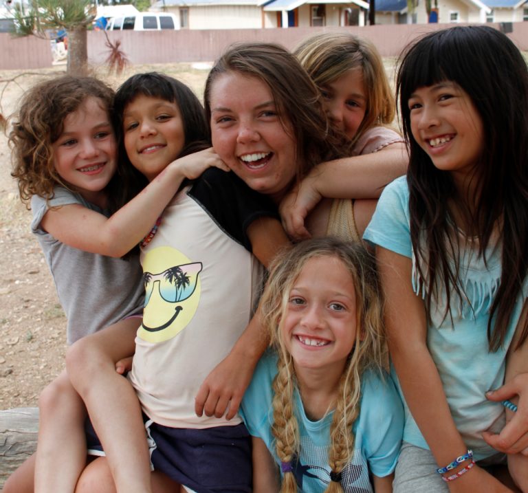 camp counselor with female campers